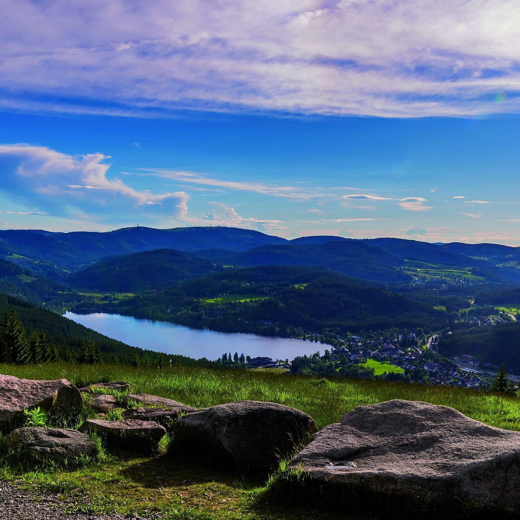 Landscape with Titisee Wide view of Lake Titisee and the Black Forest from Hochfirst with meadows, rocks and wooded hills