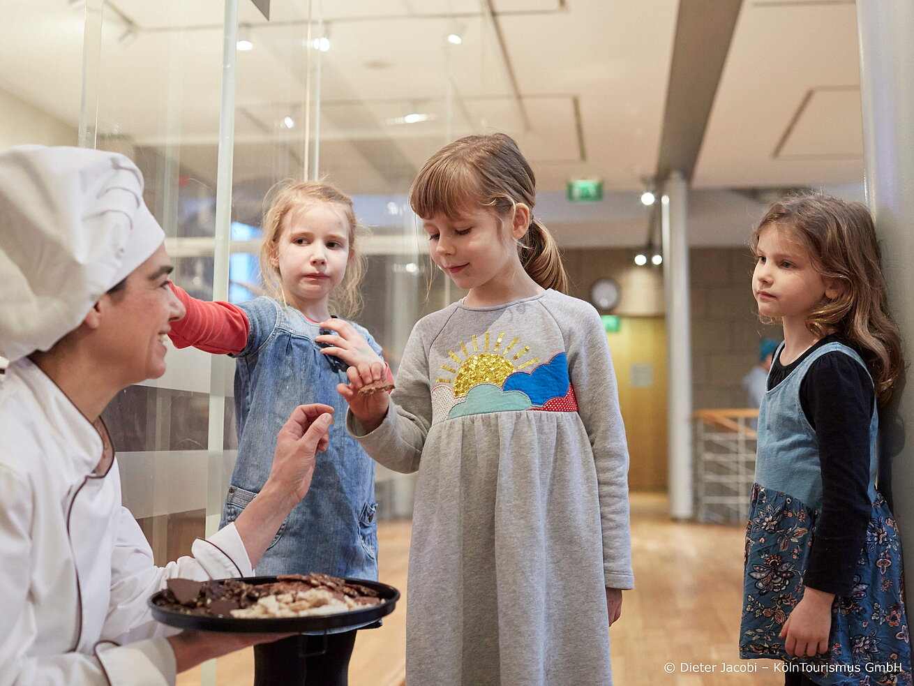 Chocolate Museum Children tasting sweets with baker or pastry chef