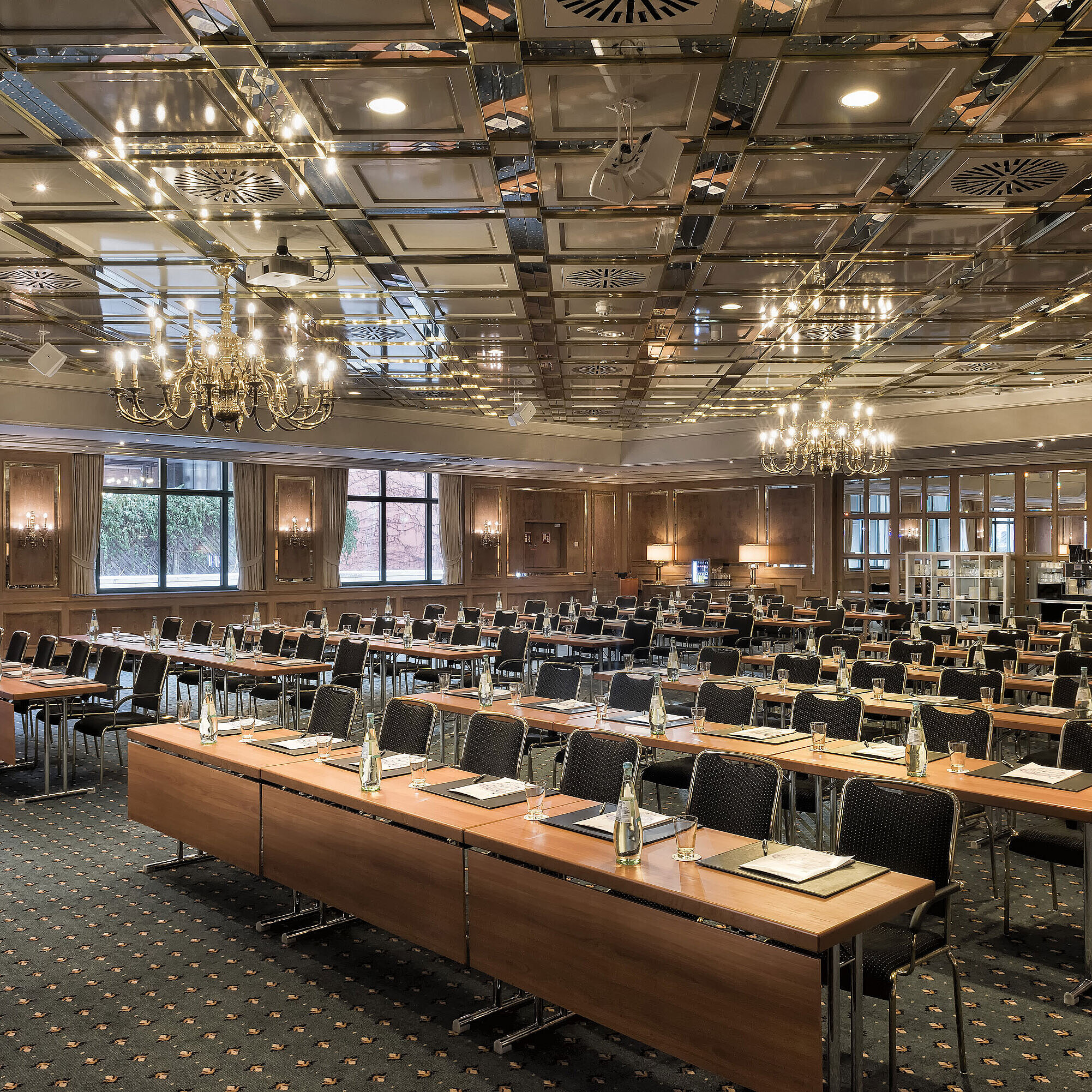 Saal Maritim classroom style Conference room with full row seating, daylight and chandeliers at Maritim Hotel Stuttgart