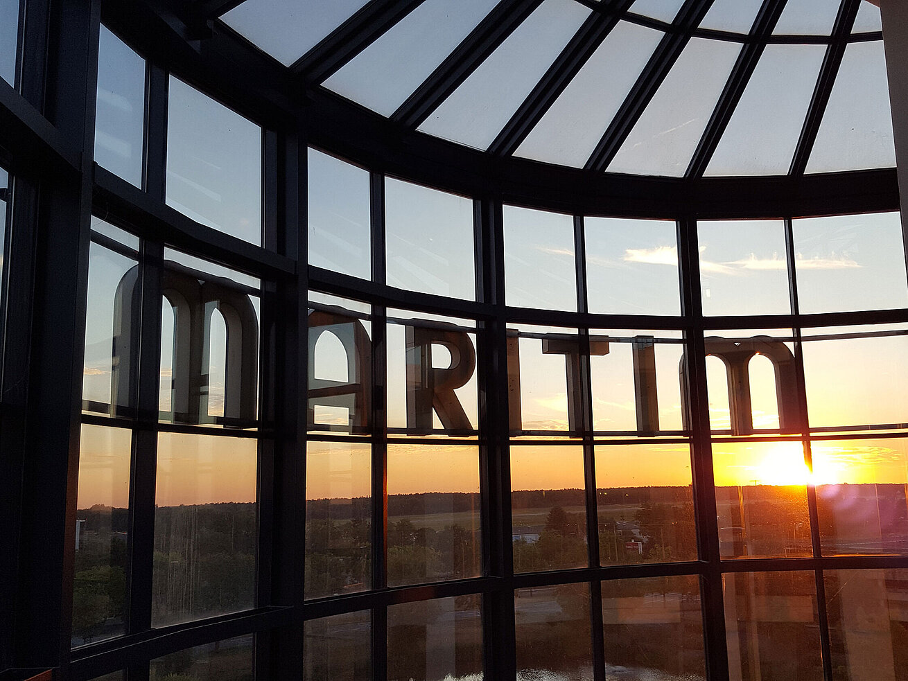 Maritim Hotels Spectacular sunset view through the glass facade of Maritim Hotel Hannover.