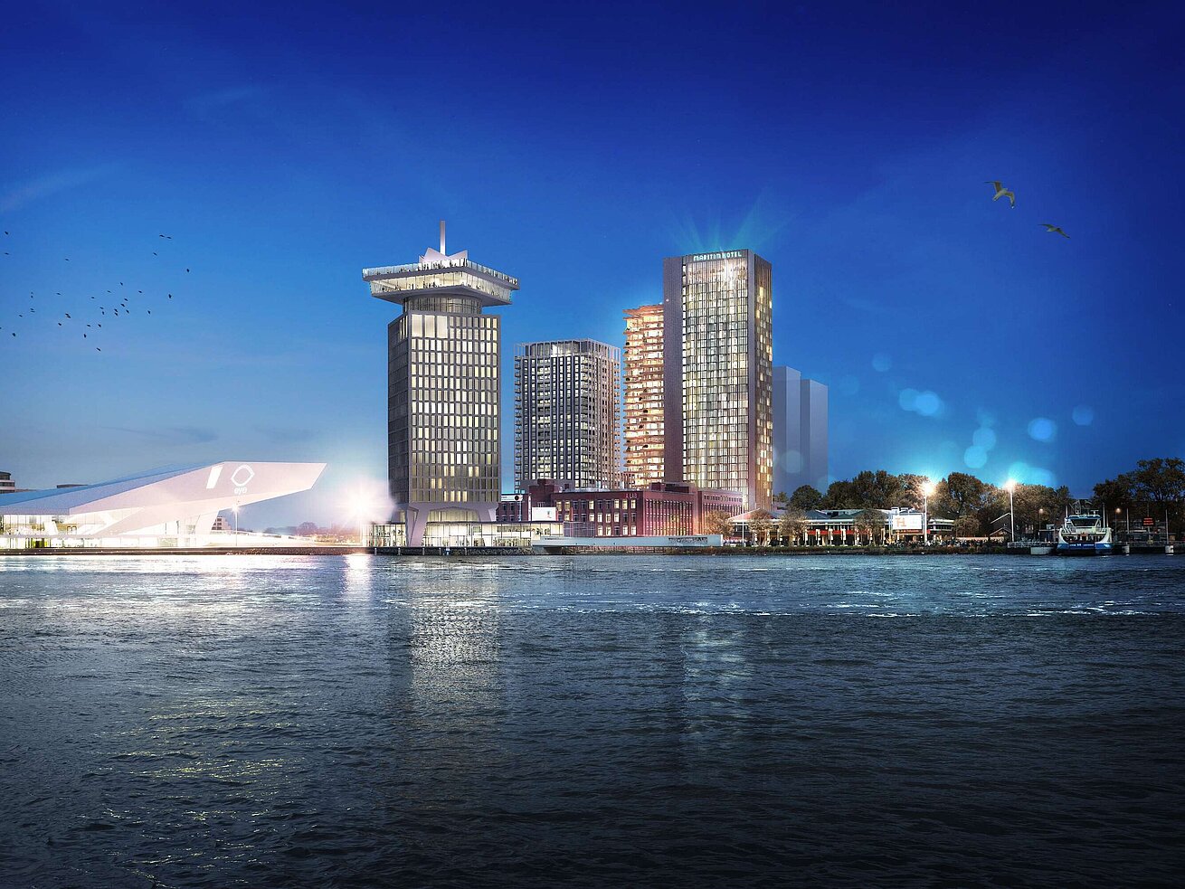 Maritim Hotel Amsterdam at night with skyline view and the IJ river