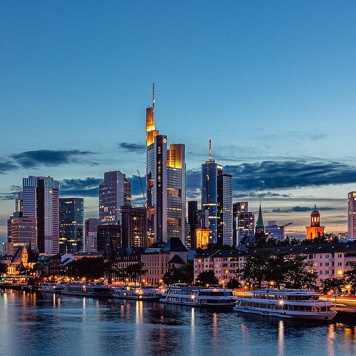 Frankfurt am Main Skyline View across the River Main towards the illuminated Frankfurt skyline at dusk.