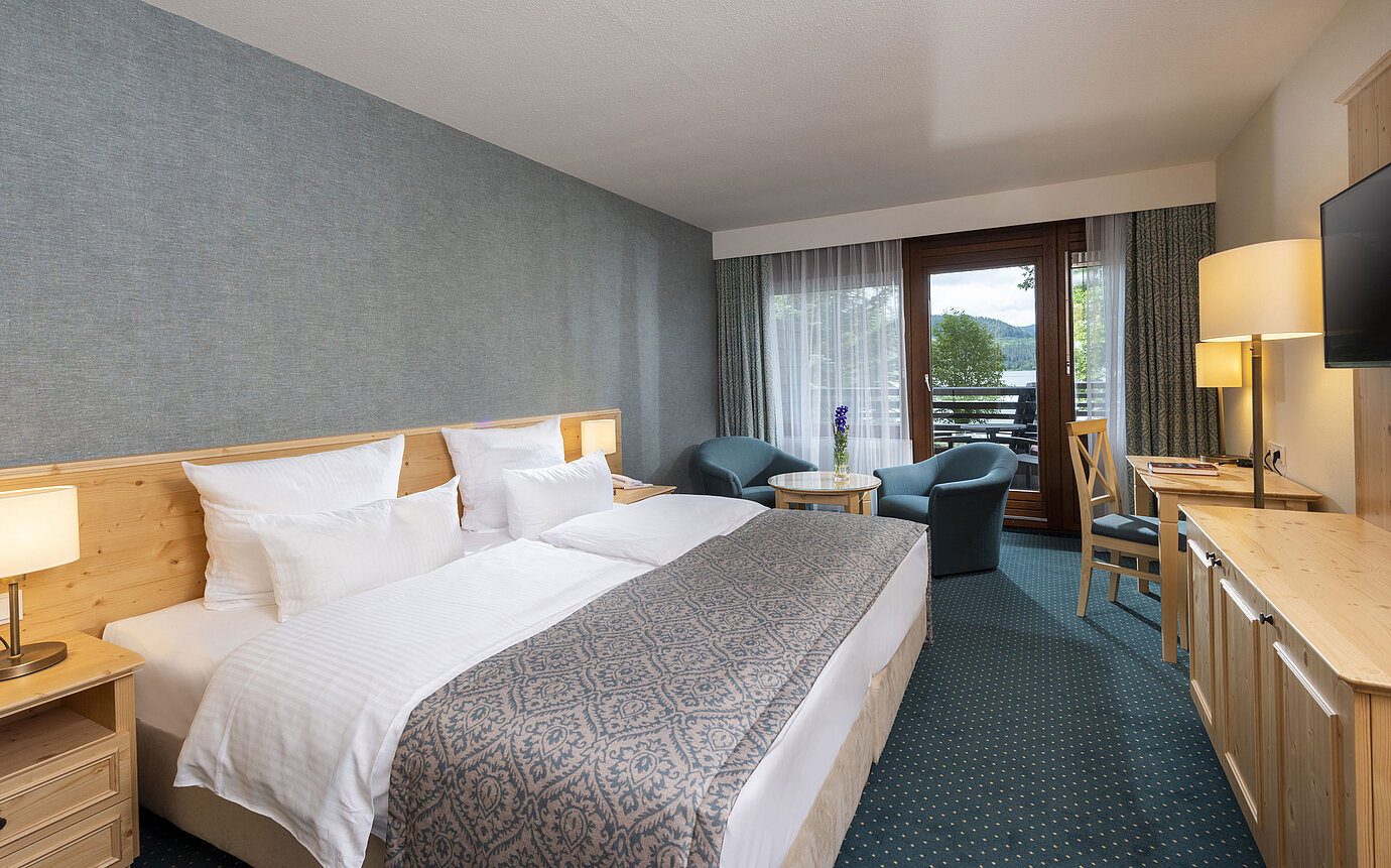 Modern hotel room at Maritim Hotel Titisee with balcony and lake view