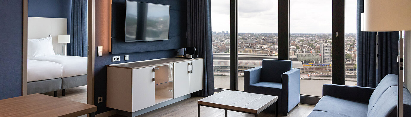 Living area with view Modern living area with city view and TV at Maritim Hotel Amsterdam