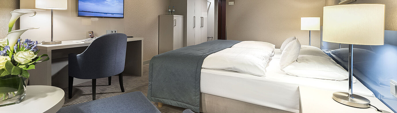 Superior room  Superior room at Maritim Hotel Bonn with double bed, desk, TV, and modern decor. Comfortable and elegant.