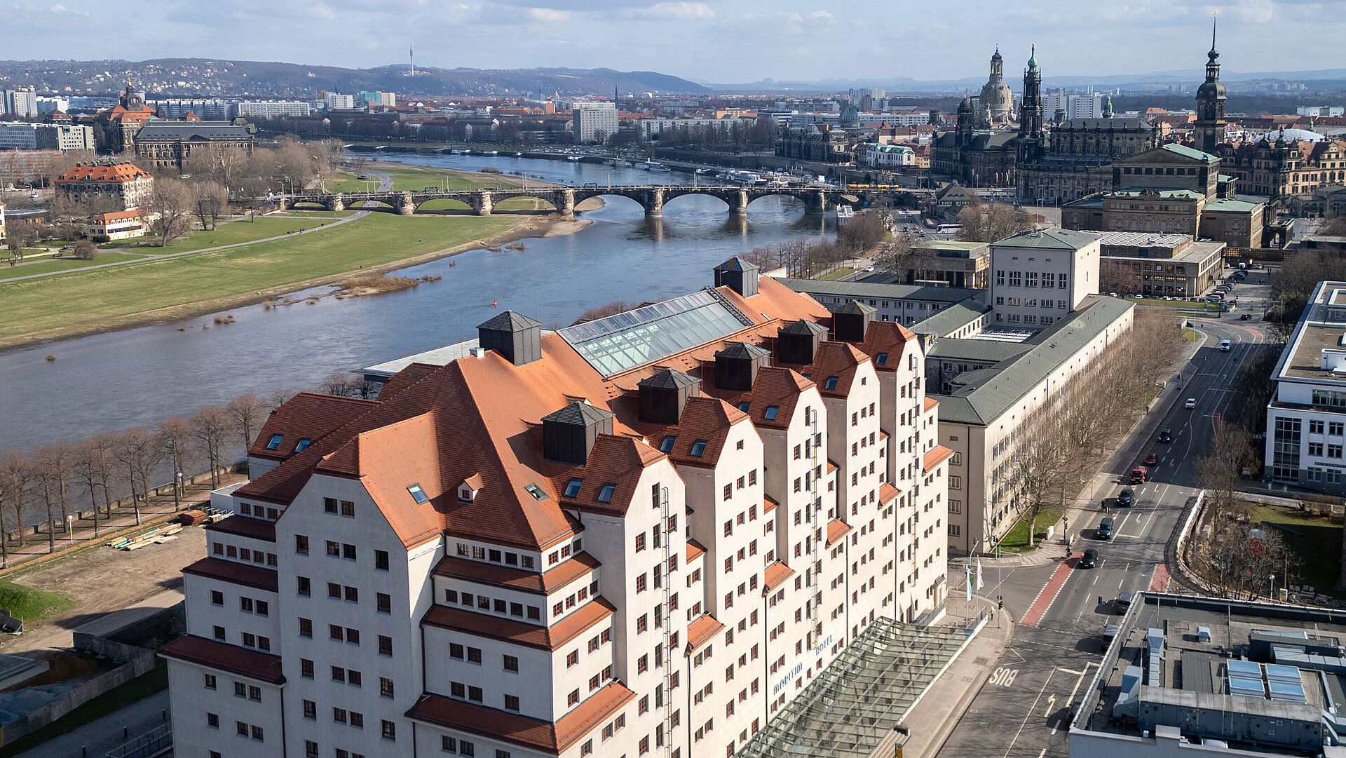 Exterior view of Maritim Hotel Dresden with distinctive architecture by the River Elbe and views of the old town.