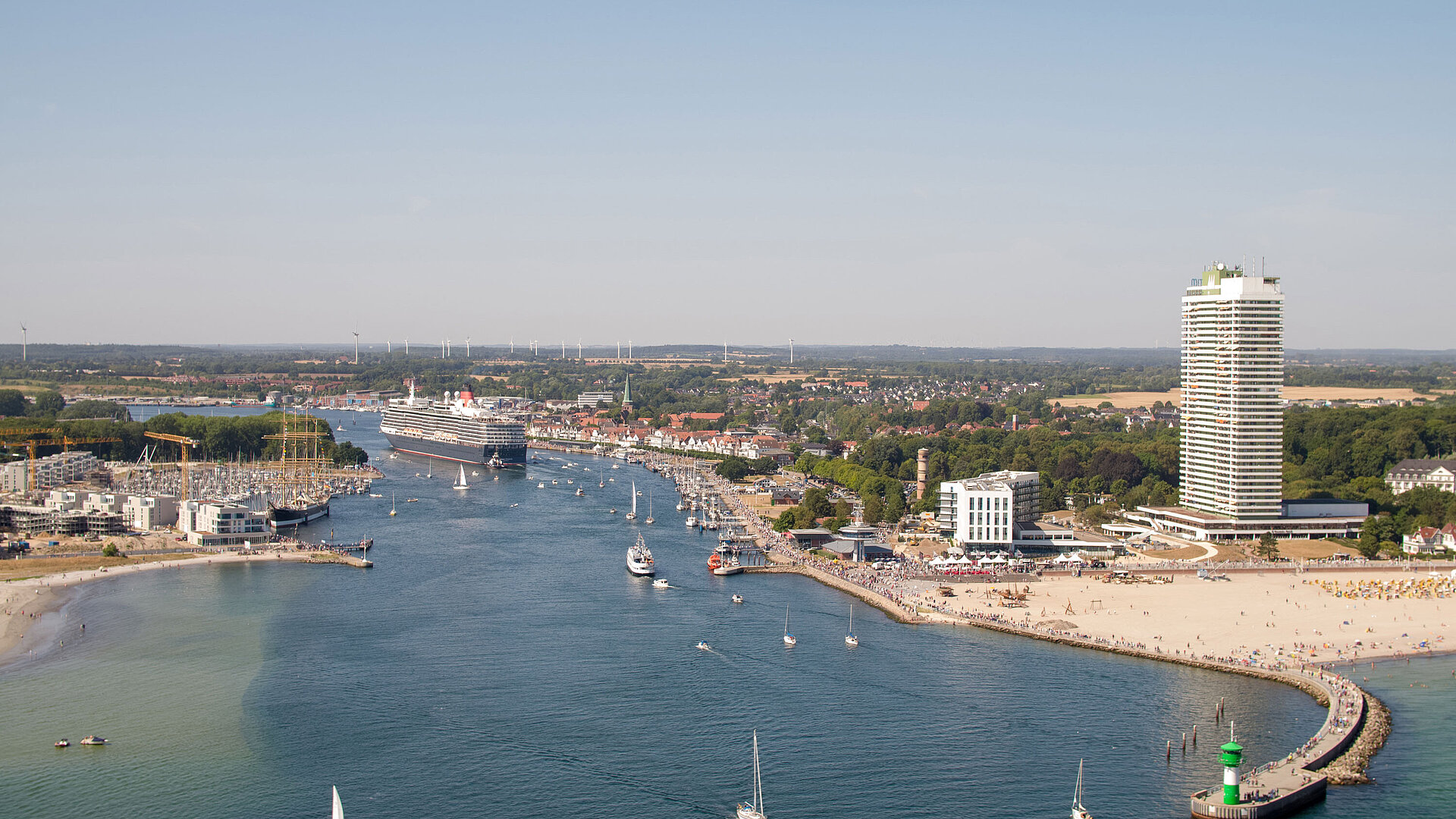 Aerial view of Travemünde with cruise ship, promenade and Maritim Hotel by the Baltic Sea