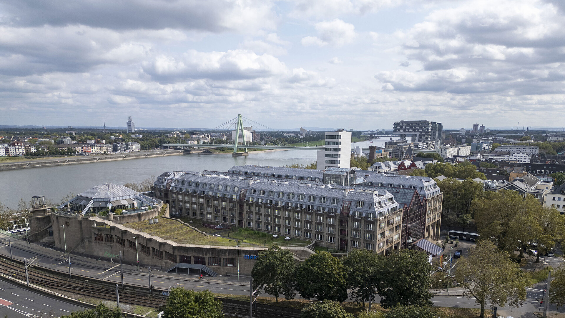 Exterior view Aerial view of the Maritim Hotel Cologne, featuring the Rhine River, Severins Bridge, and surrounding buildings.