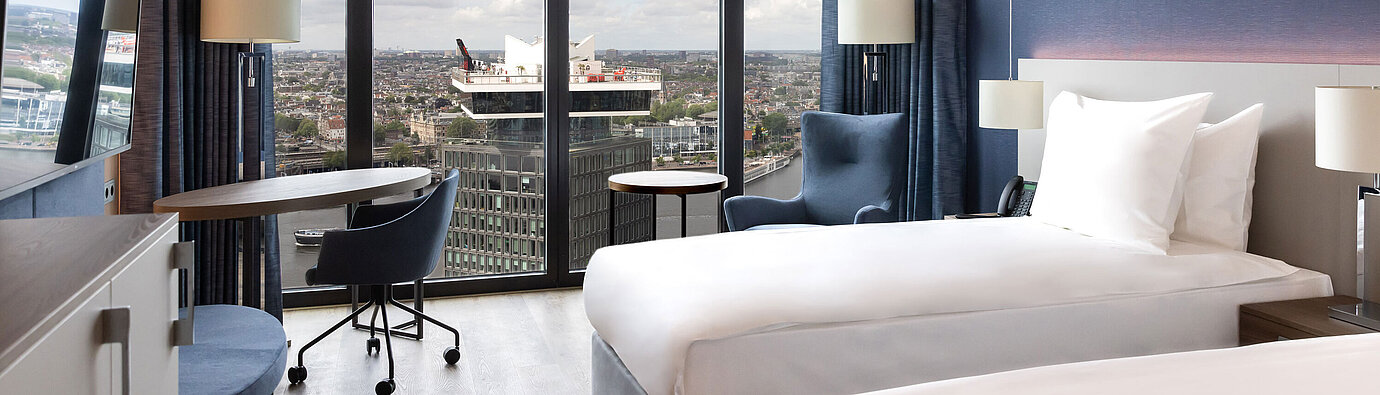 Twin Room Modern twin room in Maritim Hotel Amsterdam with panoramic city and river view