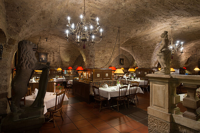 Historic restaurant at Maritim Hotel Fulda with vaulted ceiling, candlelight, and rustic ambiance.